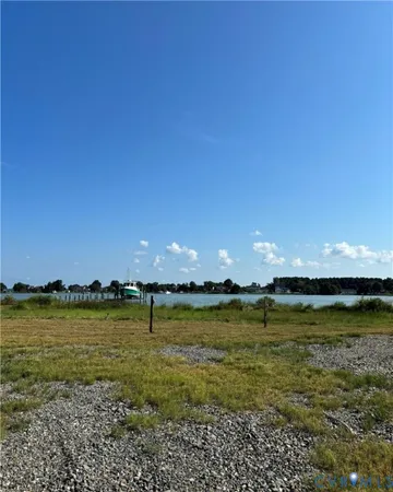 a view of a ocean with sunset in background