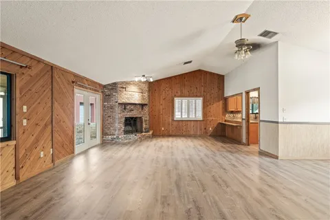 a kitchen with stainless steel appliances granite countertop a refrigerator a sink a stove and island