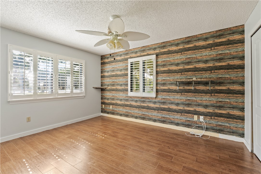 3336 8th Street Vero Beach, FL 32968 - Photo 18 of 36 a view of empty room with window and wooden floor