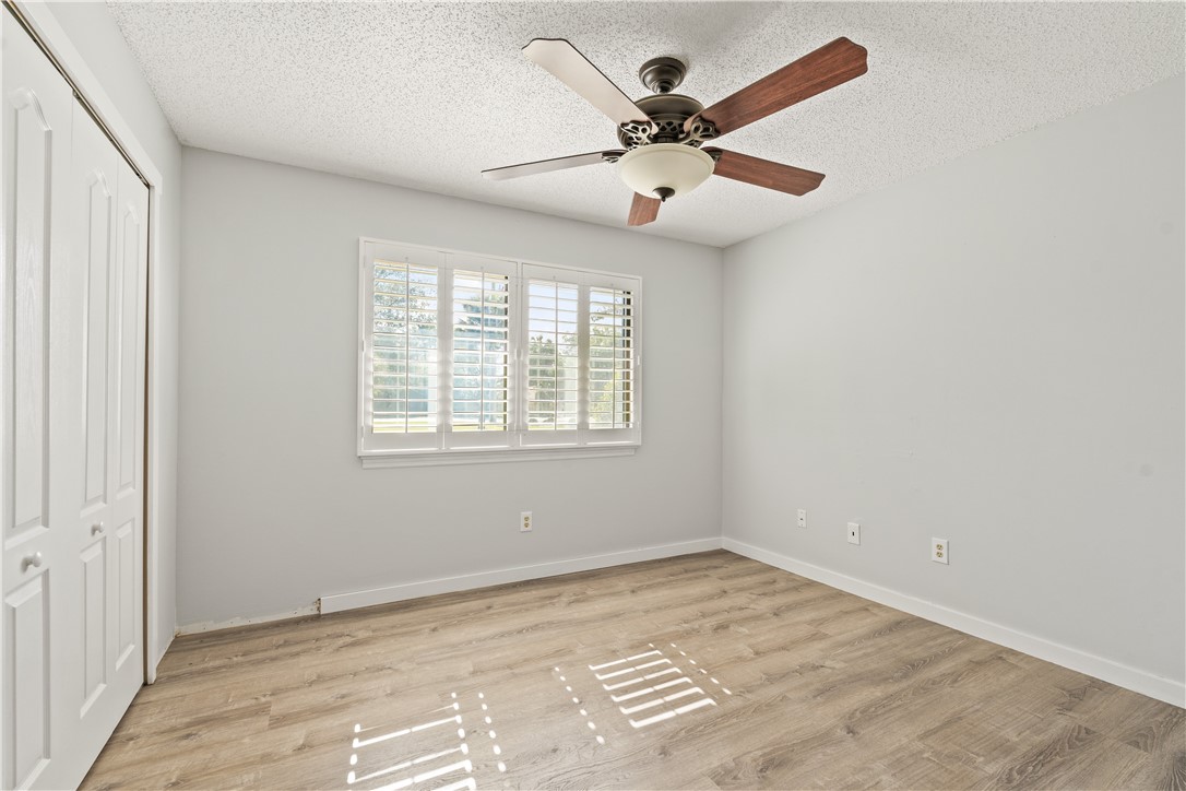 3336 8th Street Vero Beach, FL 32968 - Photo 20 of 36 an empty room with wooden floor and windows