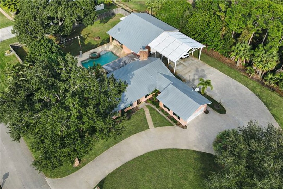 3336 8th Street Vero Beach, FL 32968 - Photo 2 of 36 an aerial view of a house with outdoor space and street view