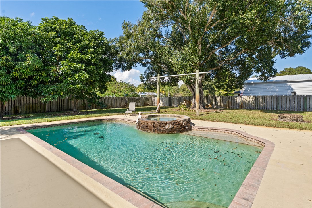 3336 8th Street Vero Beach, FL 32968 - Photo 26 of 36 a view of a backyard with a bench
