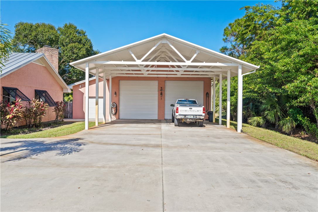 3336 8th Street Vero Beach, FL 32968 - Photo 29 of 36 a view of a house with a outdoor space and porch