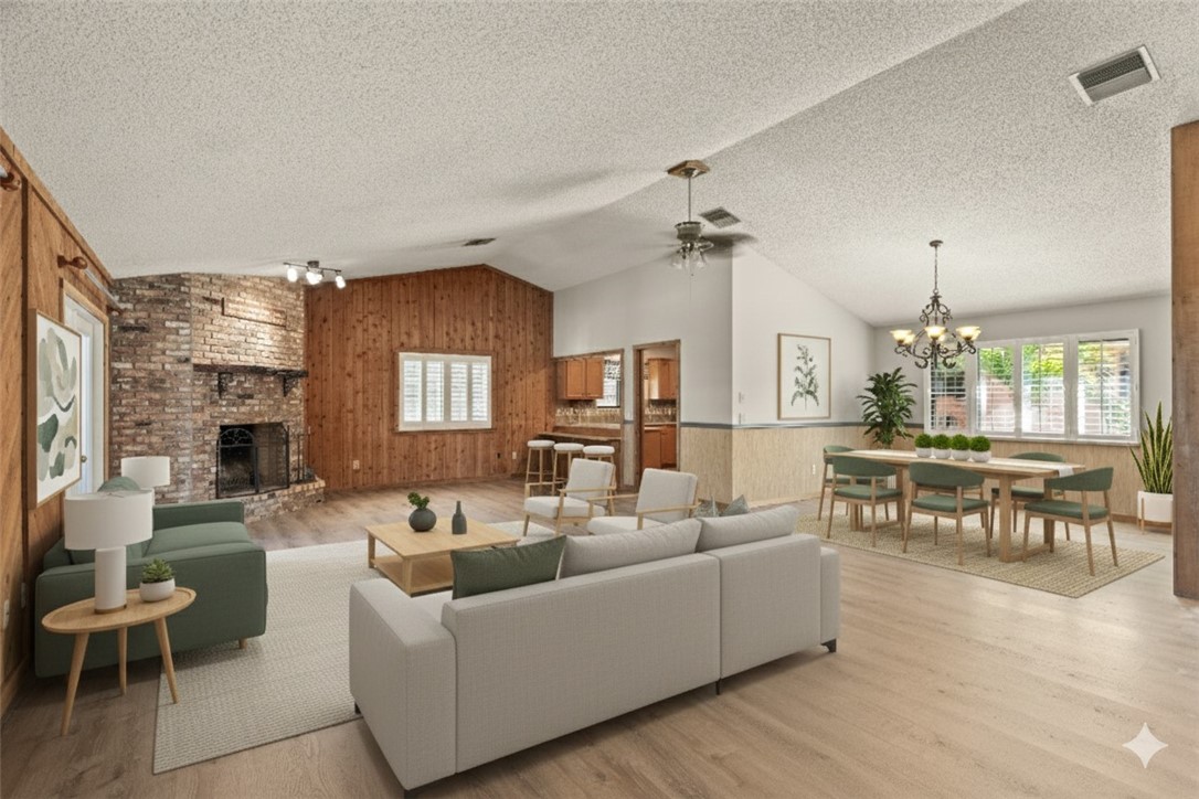 3336 8th Street Vero Beach, FL 32968 - Photo 6 of 36 a living room with furniture and a fireplace