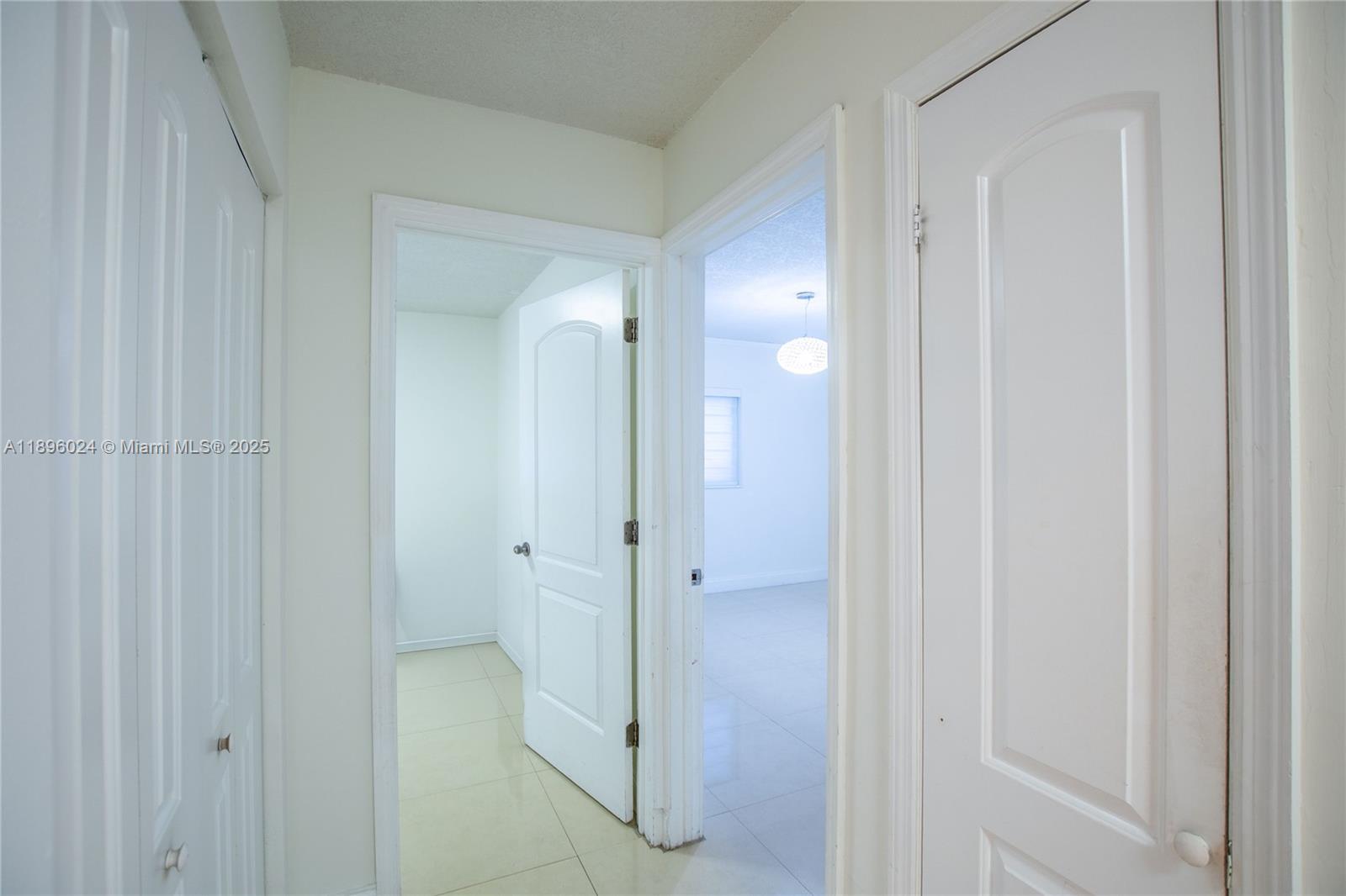 10820 Southwest 125th Street Miami, FL 33176 - Photo 13 of 46 a view of a bathroom from a hallway