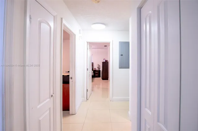 a view of a bathroom from a hallway