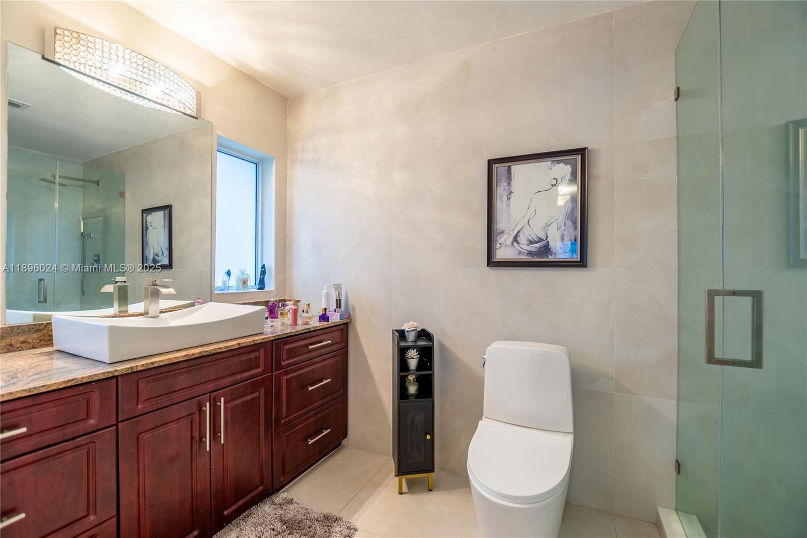 10820 Southwest 125th Street Miami, FL 33176 - Photo 20 of 46 a bathroom with a toilet a sink and mirror