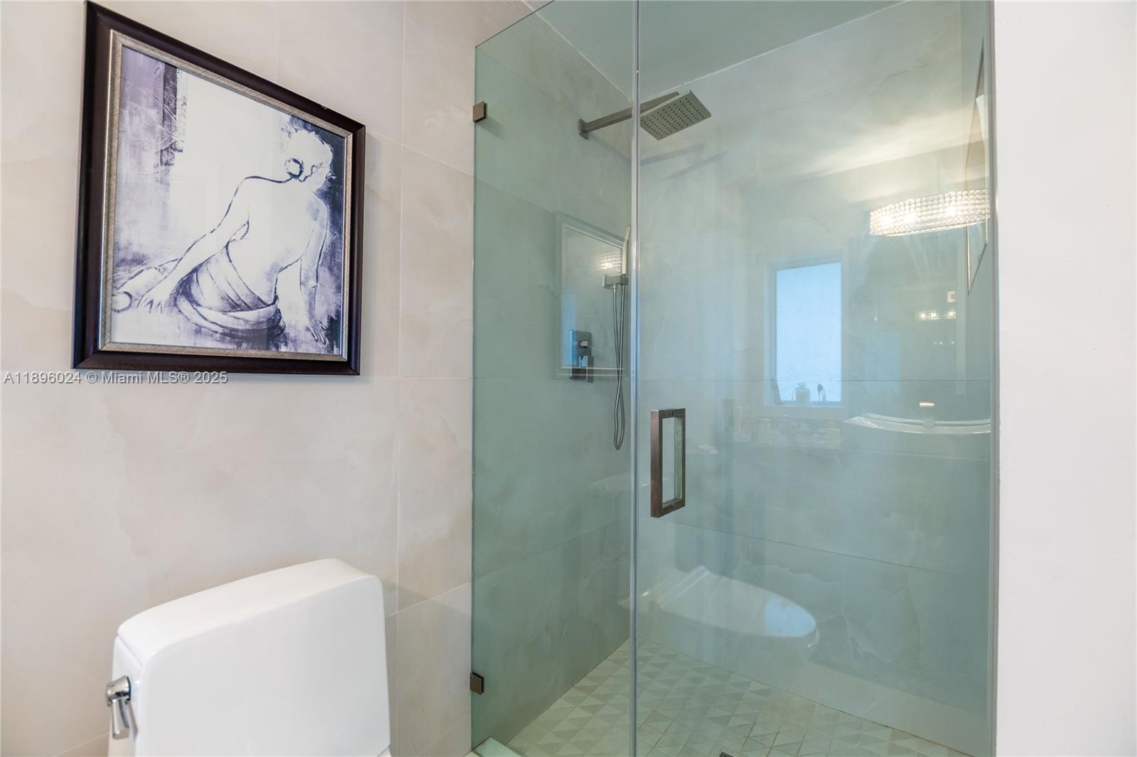 10820 Southwest 125th Street Miami, FL 33176 - Photo 21 of 46 a bathroom with a painting on the wall and shower