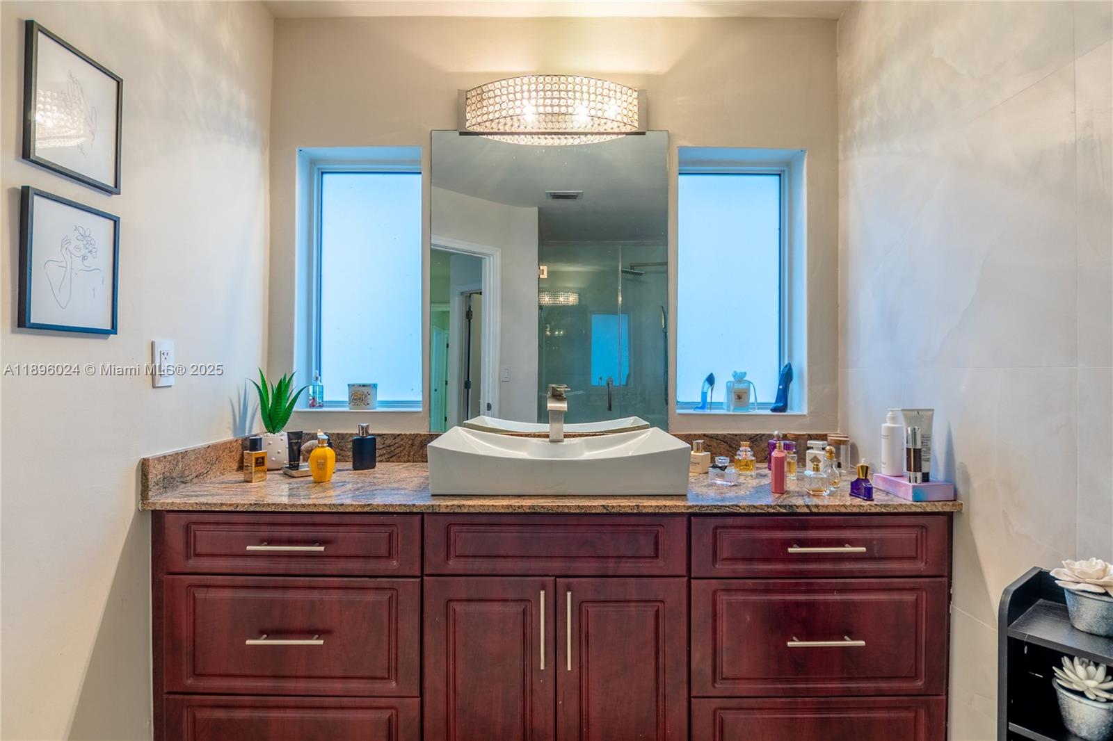 10820 Southwest 125th Street Miami, FL 33176 - Photo 22 of 46 a bathroom with a sink and a mirror