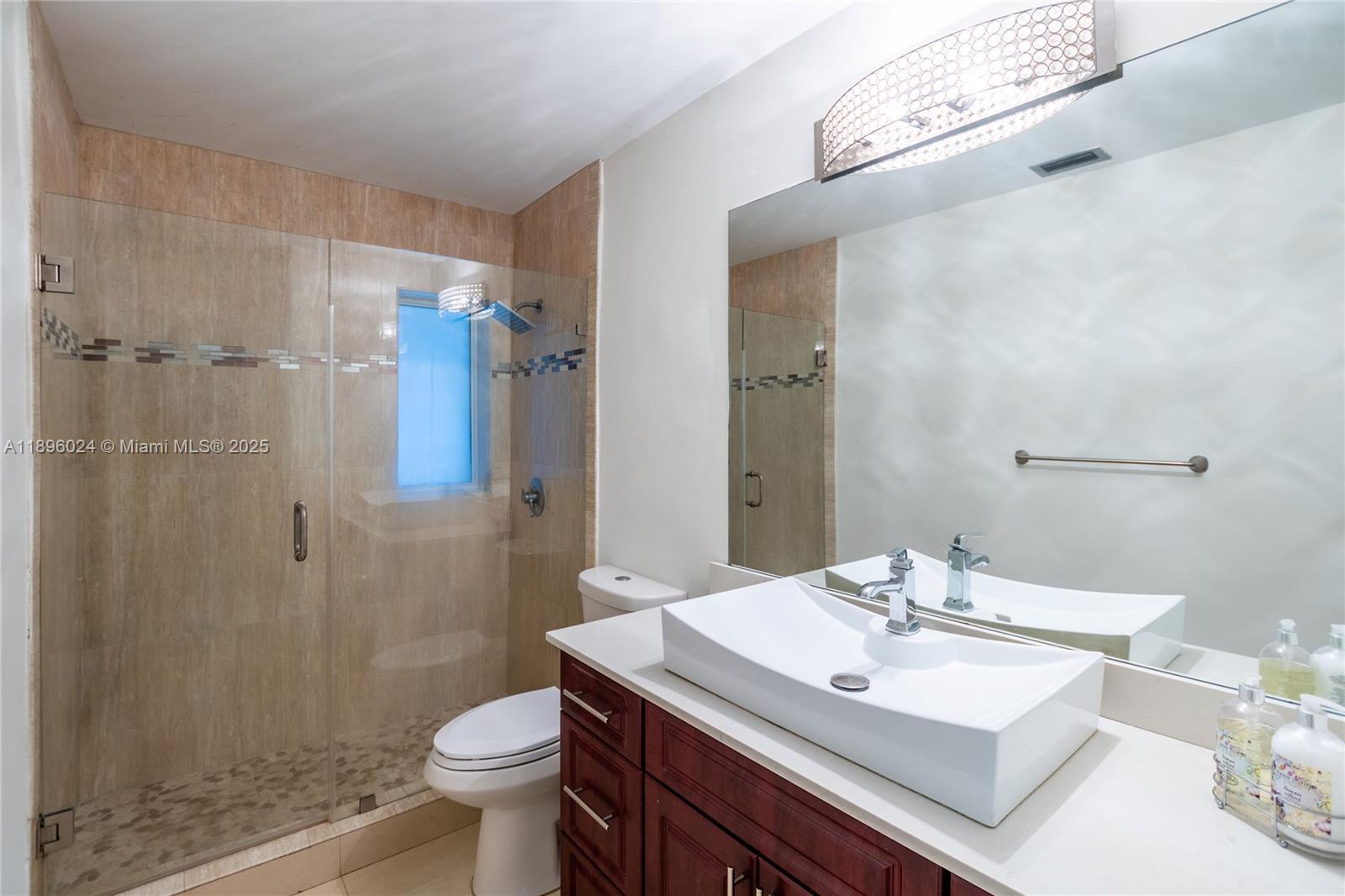 10820 Southwest 125th Street Miami, FL 33176 - Photo 25 of 46 a bathroom with a sink toilet and shower