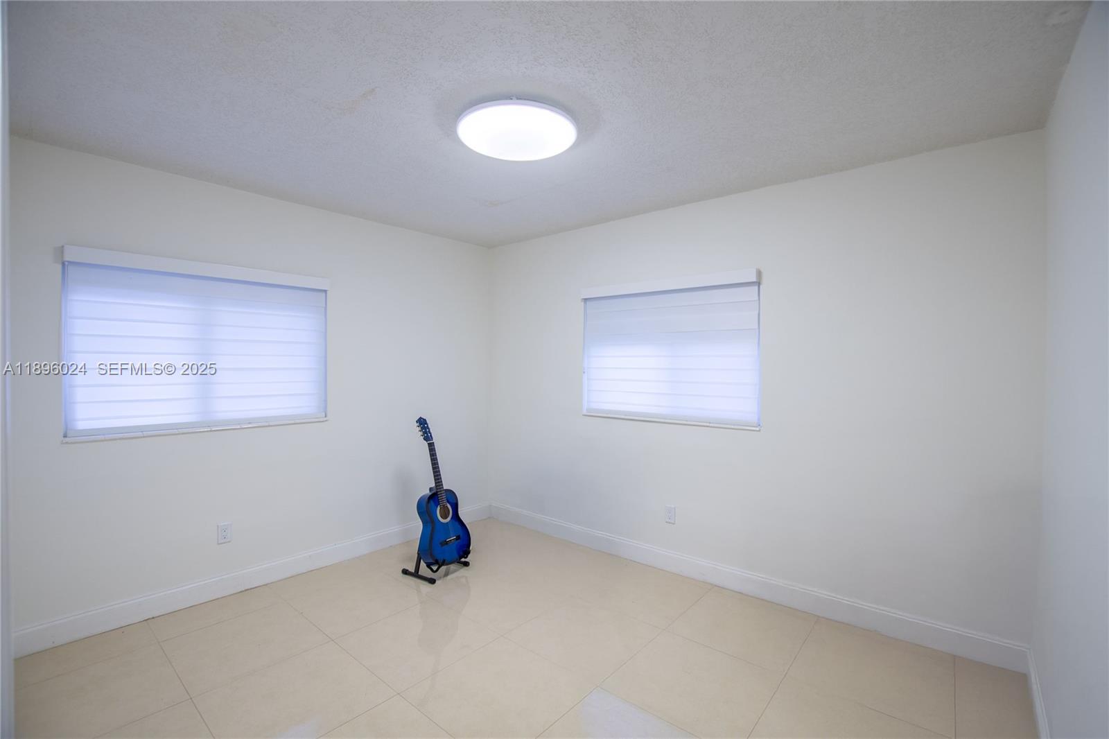 10820 Southwest 125th Street Miami, FL 33176 - Photo 29 of 46 a view of an empty room with windows