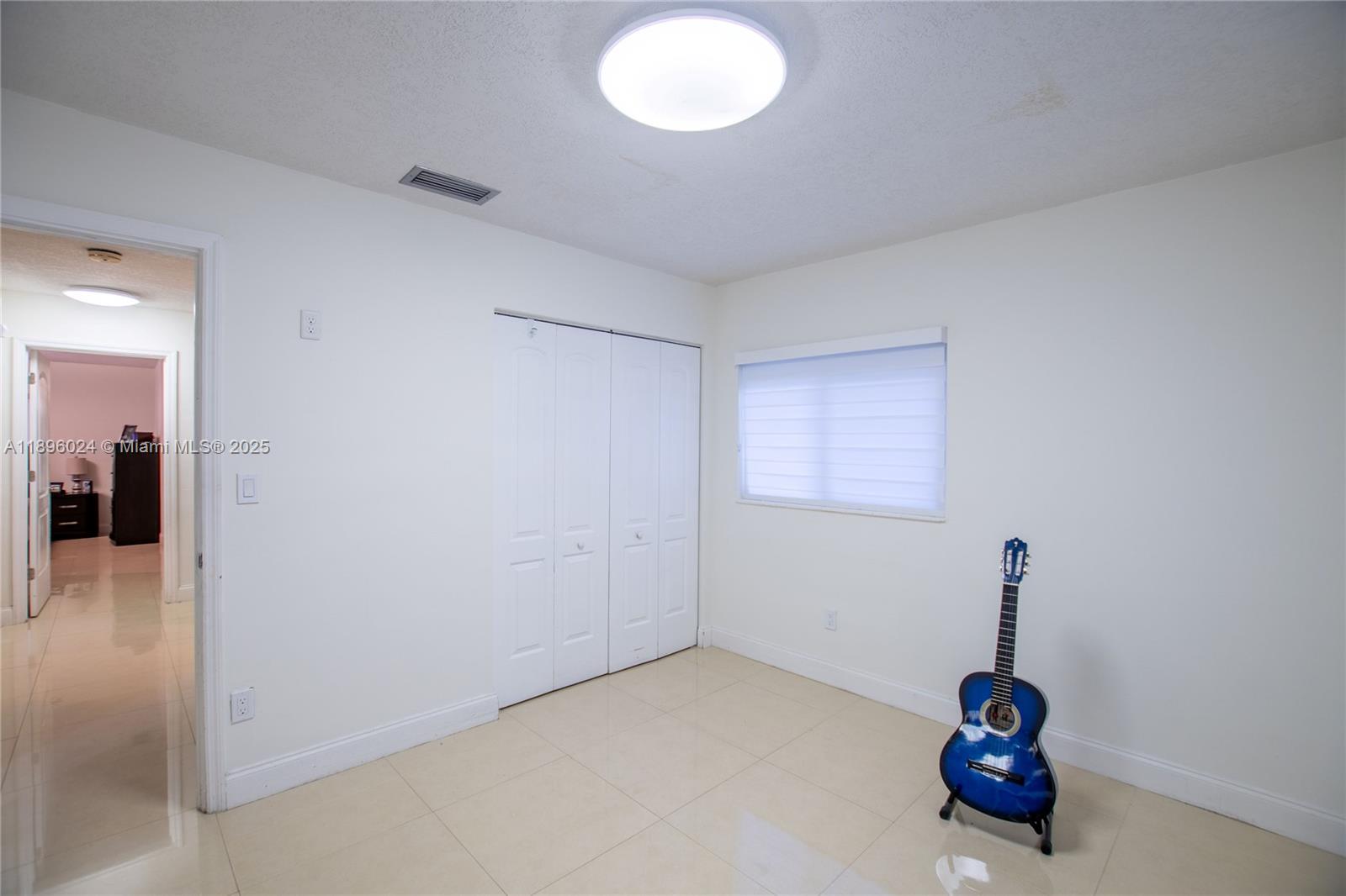 10820 Southwest 125th Street Miami, FL 33176 - Photo 30 of 46 a room with a table and a chandelier