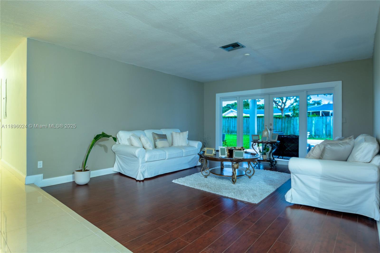 10820 Southwest 125th Street Miami, FL 33176 - Photo 3 of 46 a living room with furniture and a large window