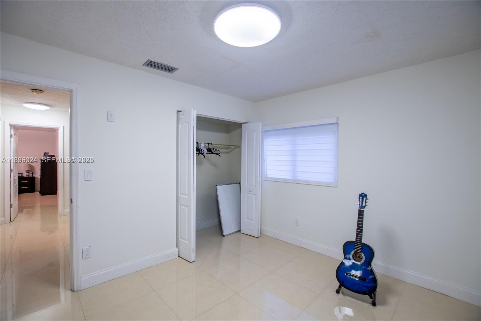 10820 Southwest 125th Street Miami, FL 33176 - Photo 31 of 46 an empty room with closet