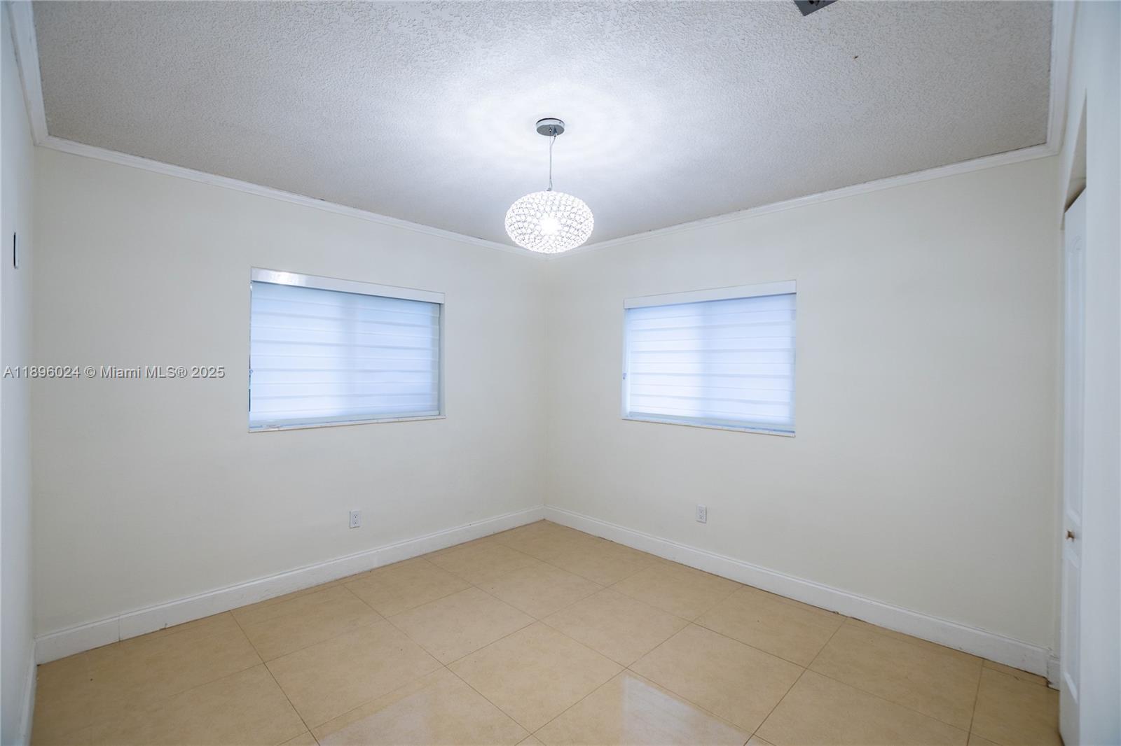10820 Southwest 125th Street Miami, FL 33176 - Photo 32 of 46 an empty room with a window
