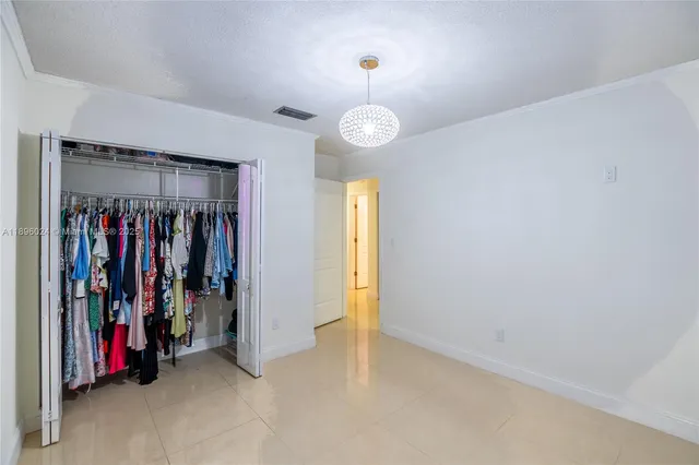 a view of a room with clothes and shoes