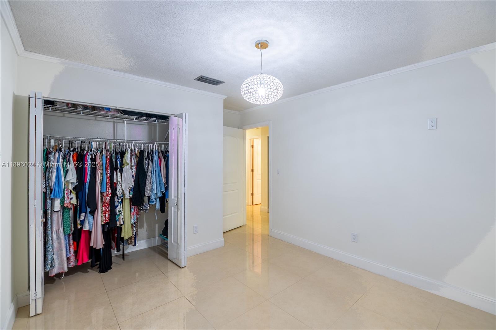 10820 Southwest 125th Street Miami, FL 33176 - Photo 33 of 46 a view of a room with clothes and shoes