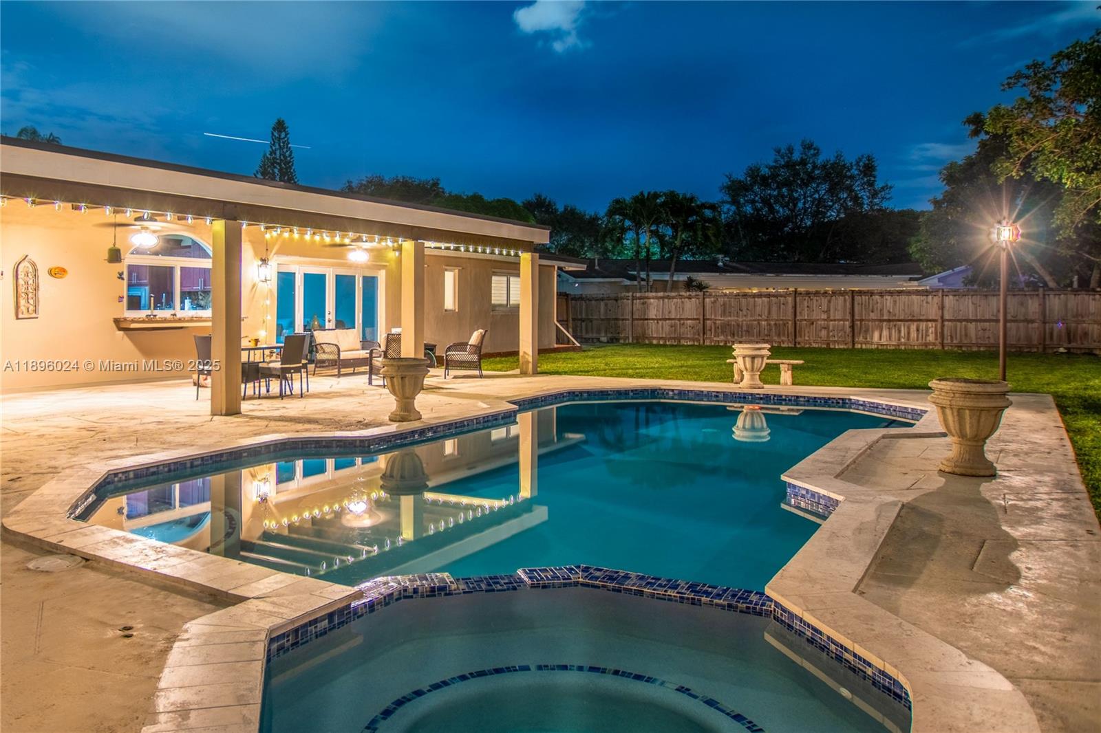 10820 Southwest 125th Street Miami, FL 33176 - Photo 37 of 46 a view of a swimming pool with a lounge chairs