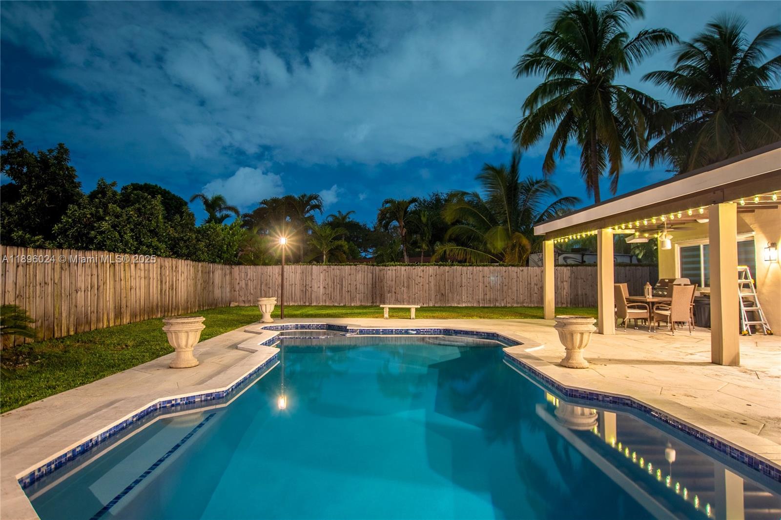 10820 Southwest 125th Street Miami, FL 33176 - Photo 38 of 46 a swimming pool with outdoor seating and yard