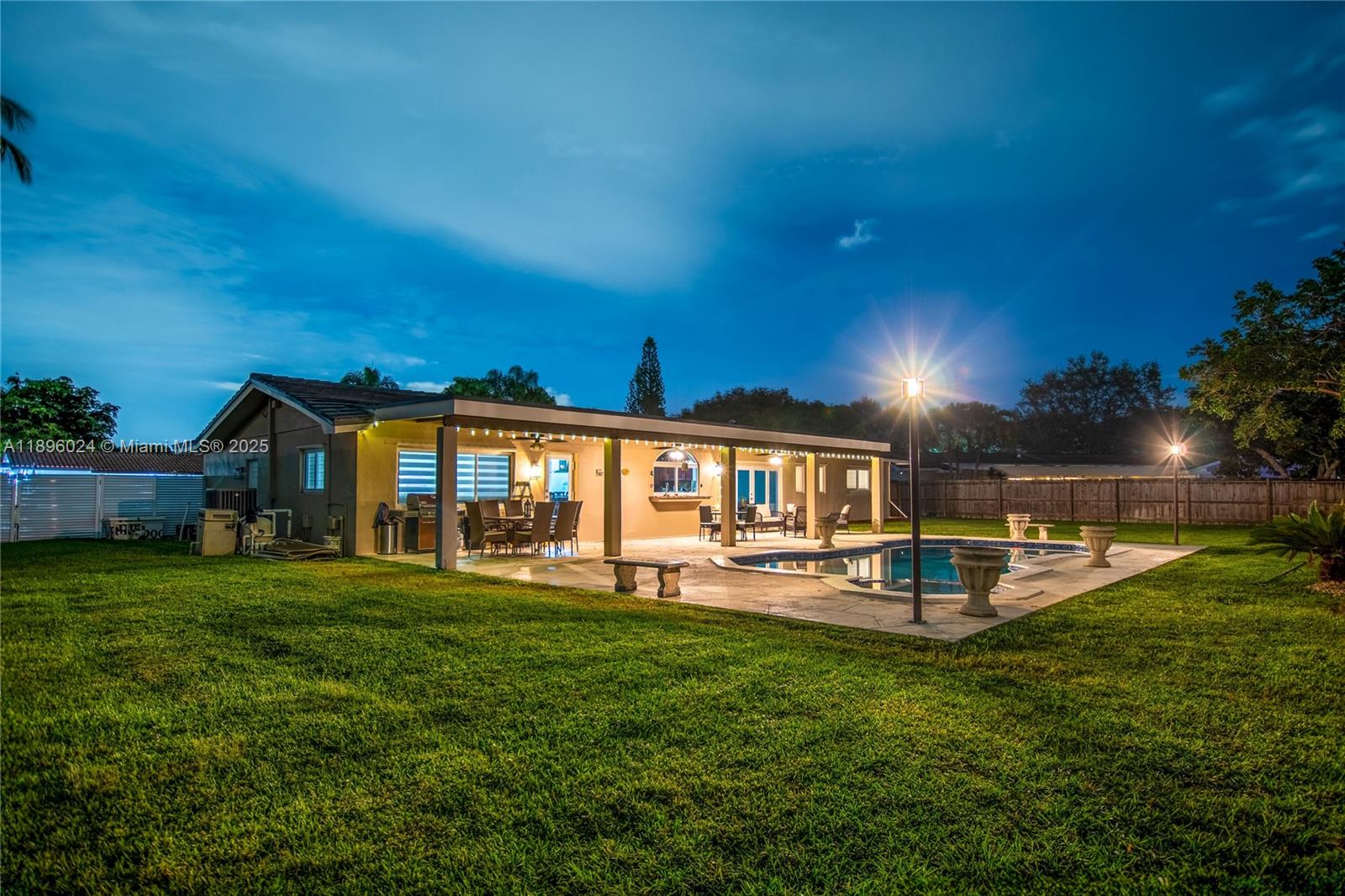 10820 Southwest 125th Street Miami, FL 33176 - Photo 40 of 46 a view of a house with a big yard