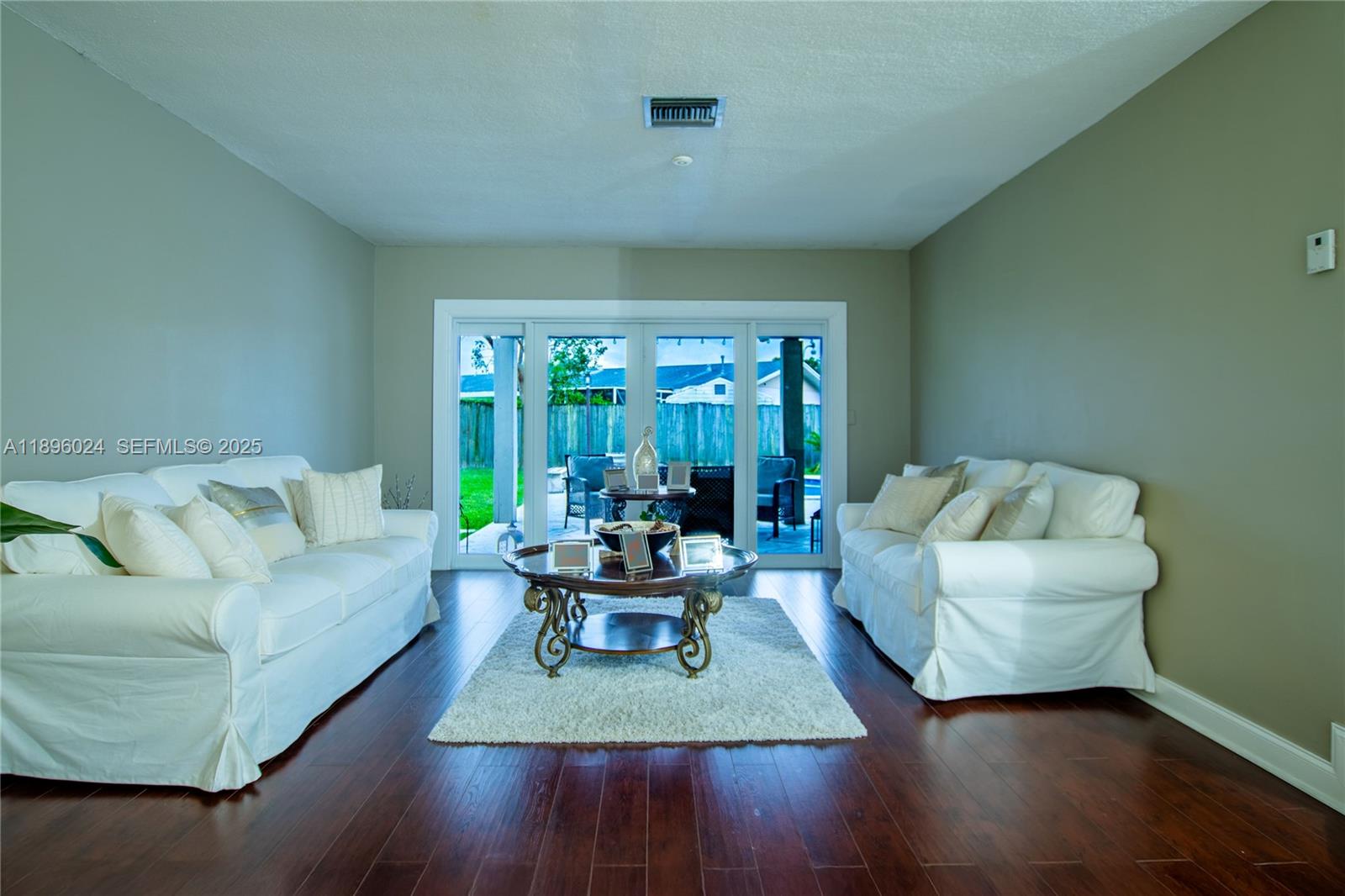 10820 Southwest 125th Street Miami, FL 33176 - Photo 4 of 46 a living room with furniture and a large window