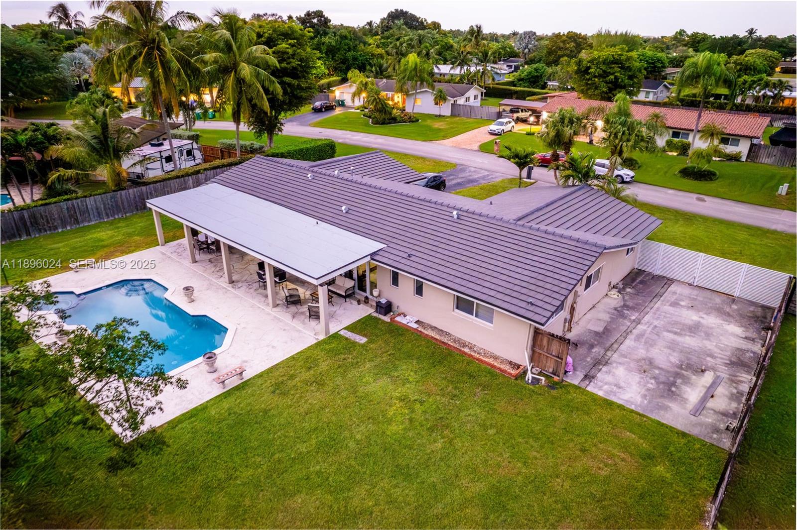 10820 Southwest 125th Street Miami, FL 33176 - Photo 44 of 46 an aerial view of a house with swimming pool garden and lake view