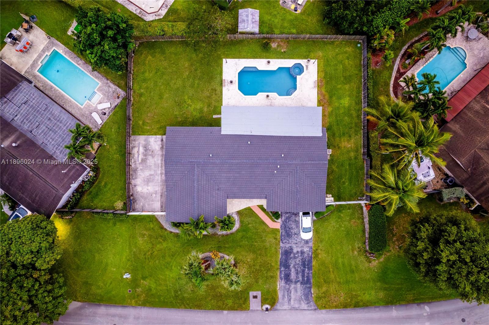 10820 Southwest 125th Street Miami, FL 33176 - Photo 45 of 46 an aerial view of a house with garden space and street view
