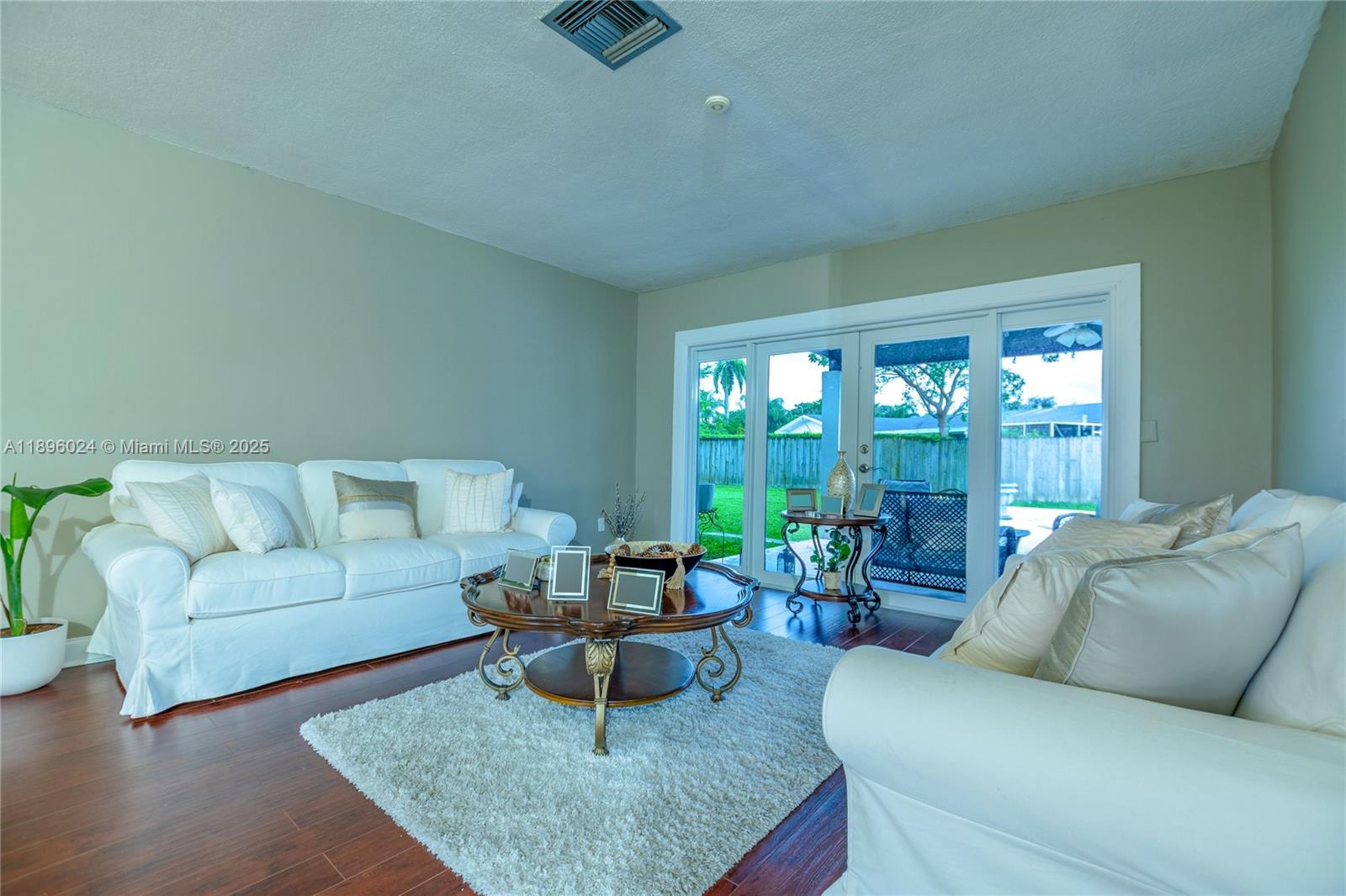 10820 Southwest 125th Street Miami, FL 33176 - Photo 7 of 46 a living room with furniture and a large window
