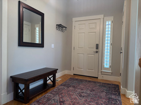 514 North Olympic Way Midway, UT 84049 - Photo 17 of 30 Foyer featuring light-toned walls, wood-finish flooring, a paneled entry door, and a sidelight window