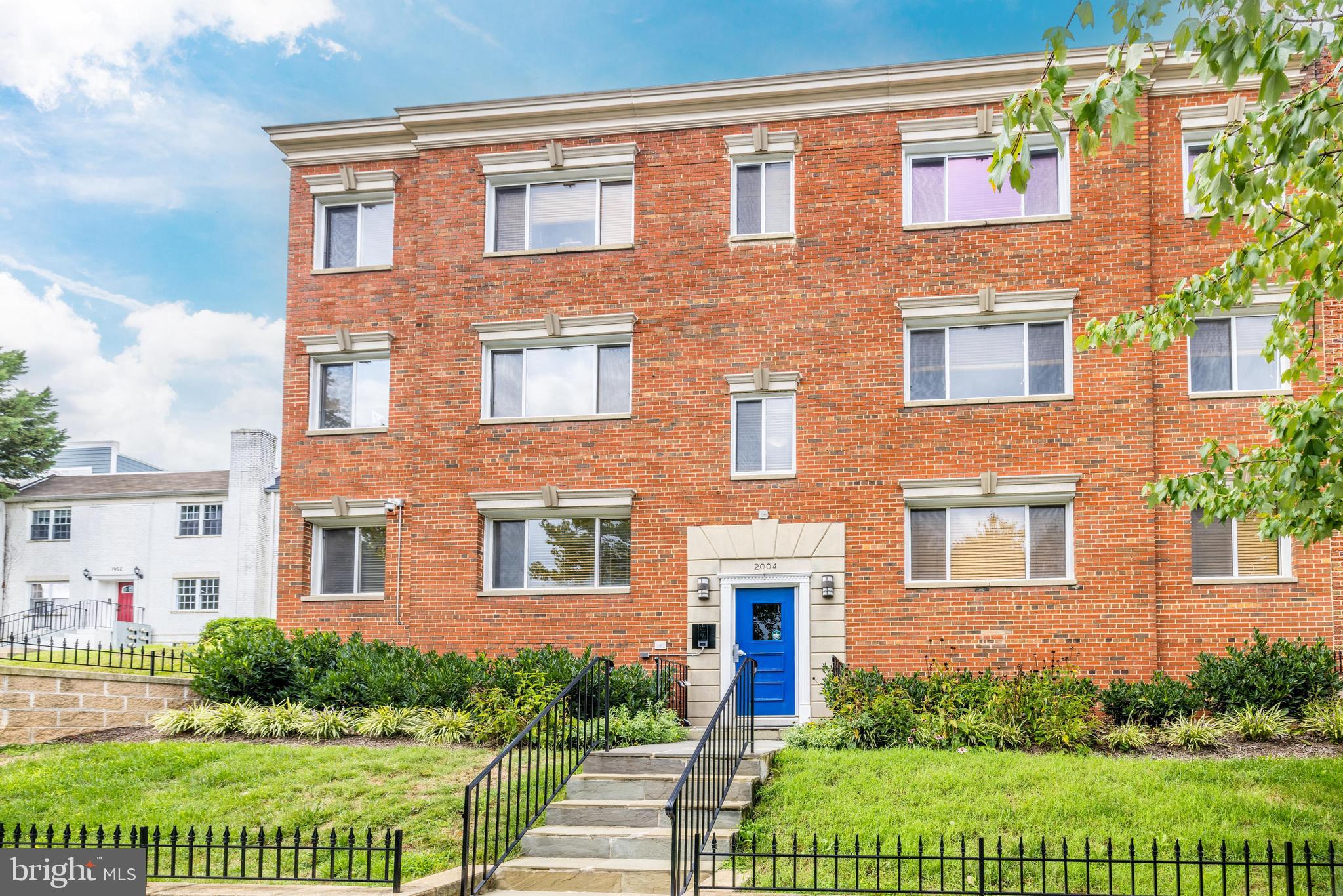 2004 3rd Street Northeast, Unit 201 Washington, DC 20002 - Photo 2 of 35 a brick building that has a lots of windows in it
