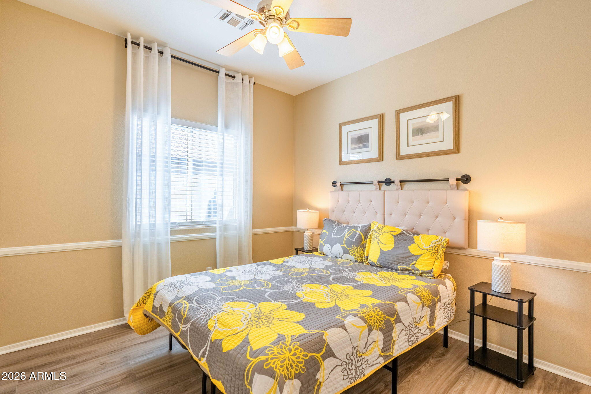 3674 South Joshua Tree Lane Gilbert, AZ 85297 - Photo 19 of 30 a bedroom with a bed and wooden floor