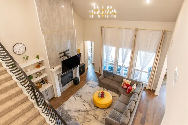 a living room with furniture a rug and a window