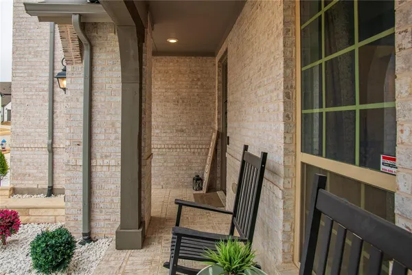 a view of a balcony with chairs