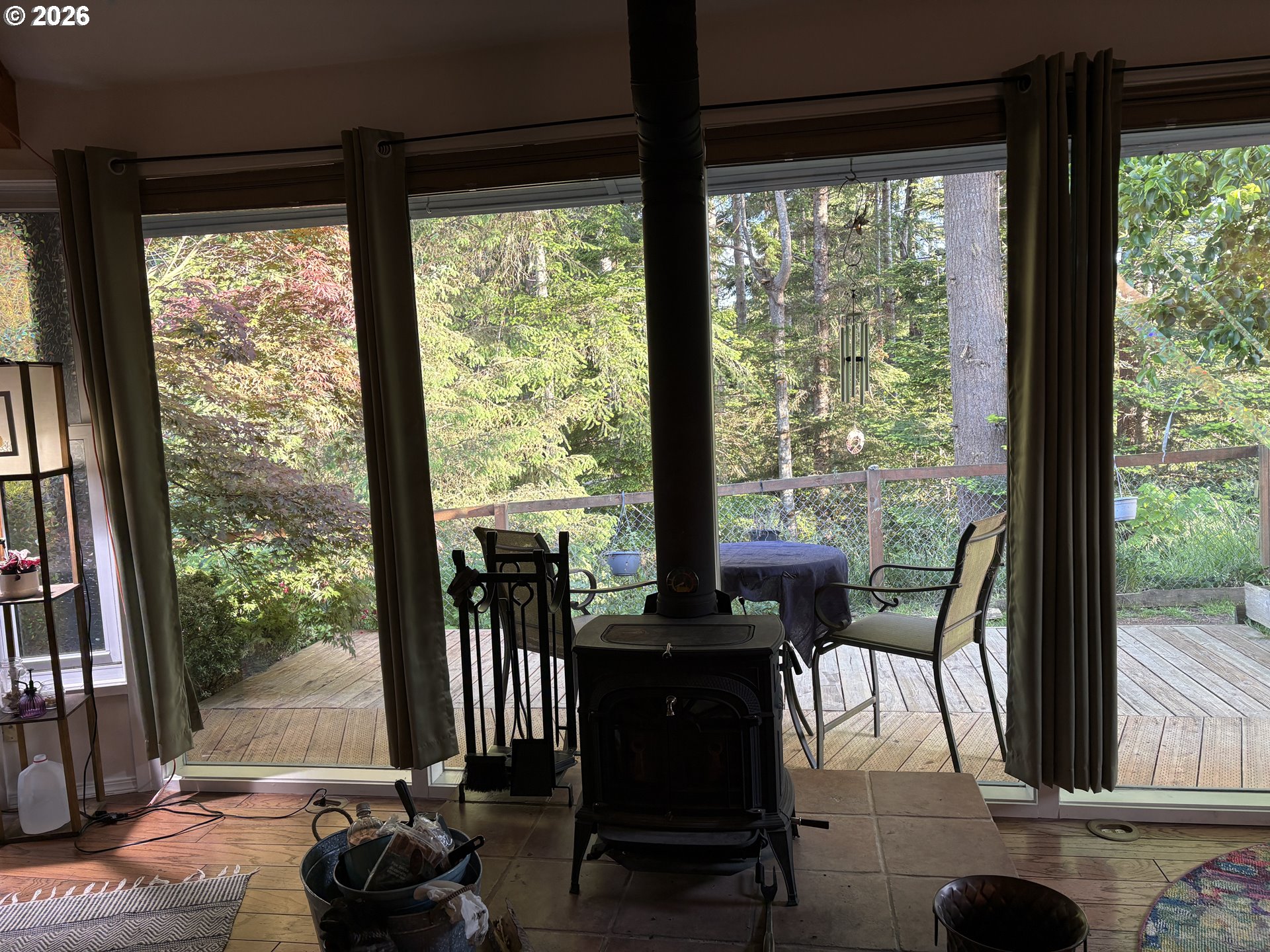 1625 Kristi Loop Lakeside, OR 97449 - Photo 14 of 41 a view of a dining room with wooden floor and a floor to ceiling window