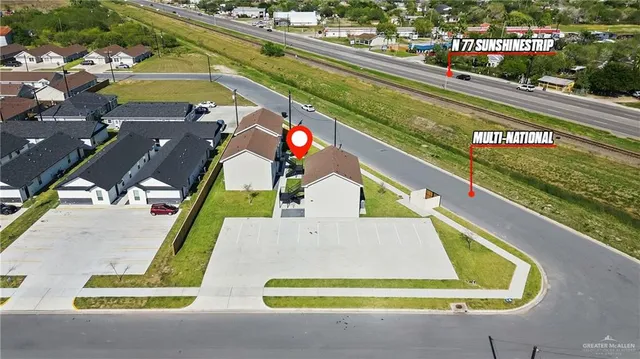 a view of a park with potted plants