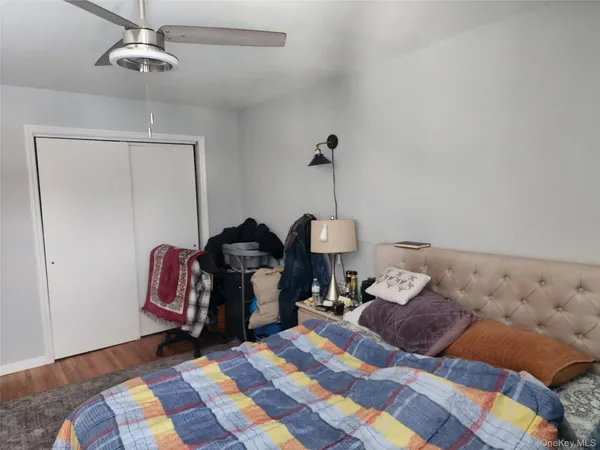 a bed room with a bed and a chandelier