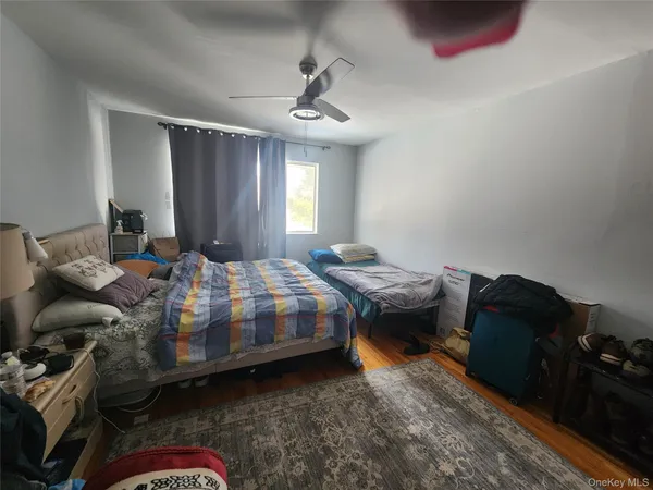 a bedroom with bed and a dresser