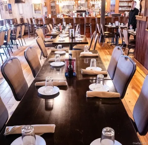 a view of a patio with table and chairs