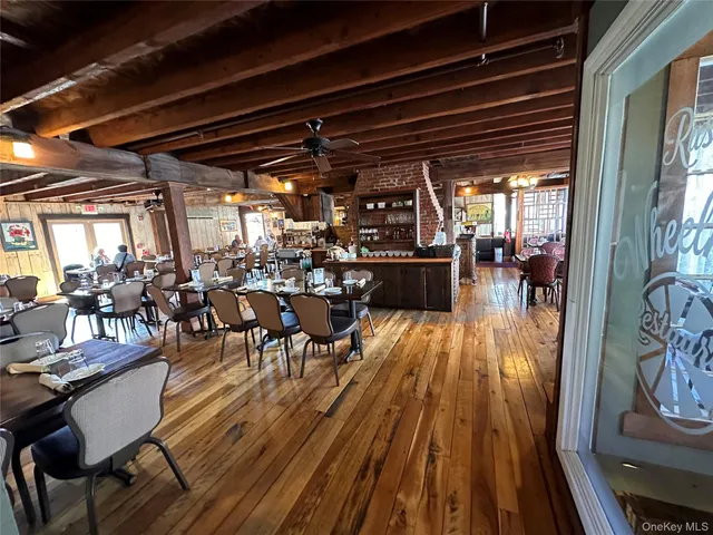 a view of a room that has a table and chairs