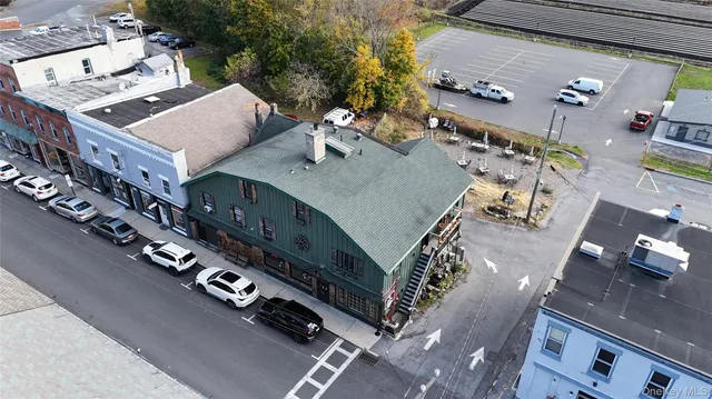 an aerial view of a house parking space and garden view