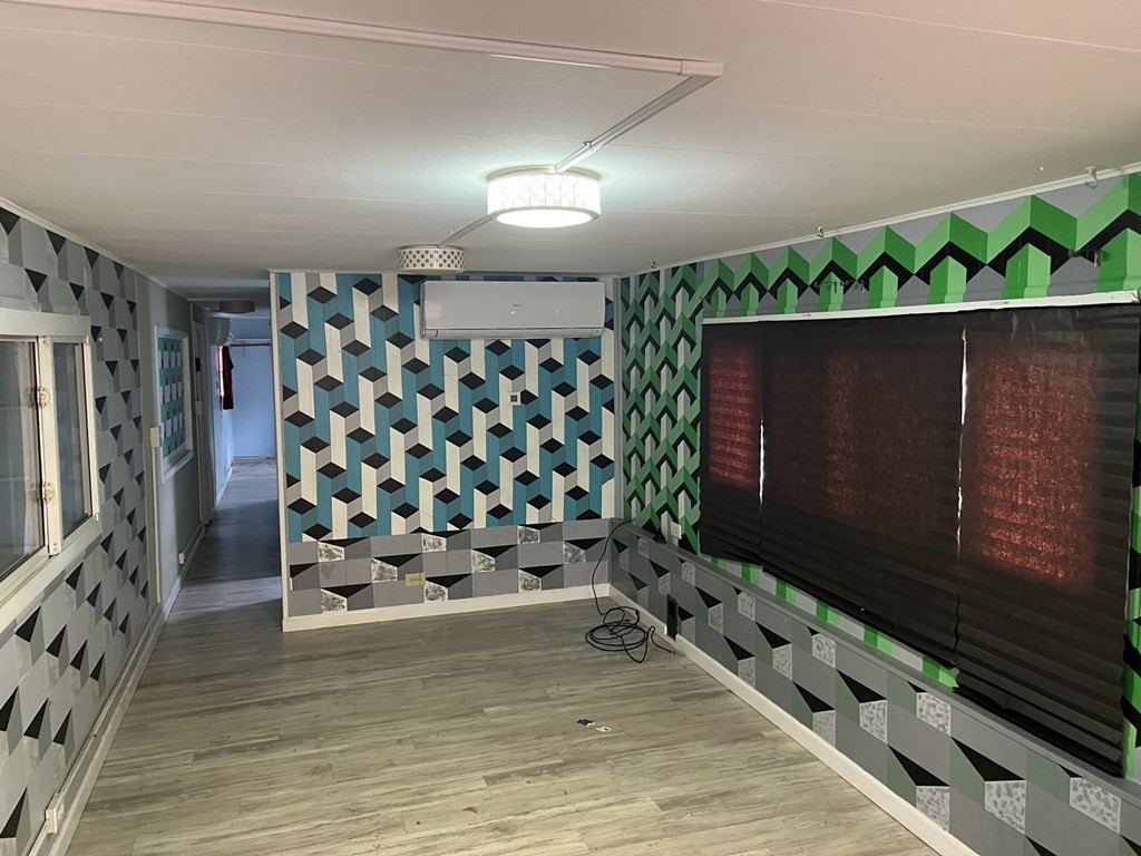 39 Mobile Home Way Springfield, MA 01119 - Photo 9 of 11 a room with lots of wooden furniture and potted plants