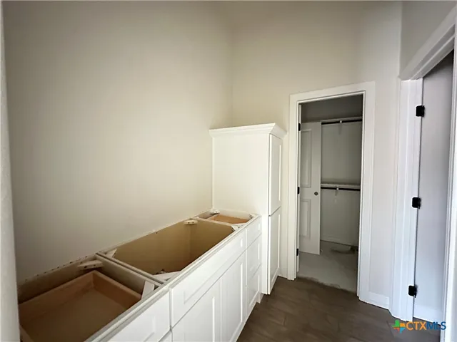 a kitchen with a refrigerator and a sink