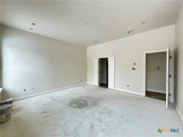 a spacious bathroom with a granite countertop tub sink and mirror