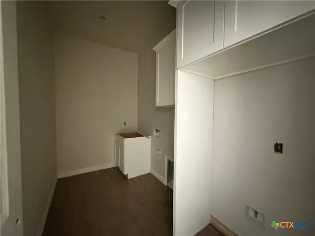 a view of a storage & utility room with a sink