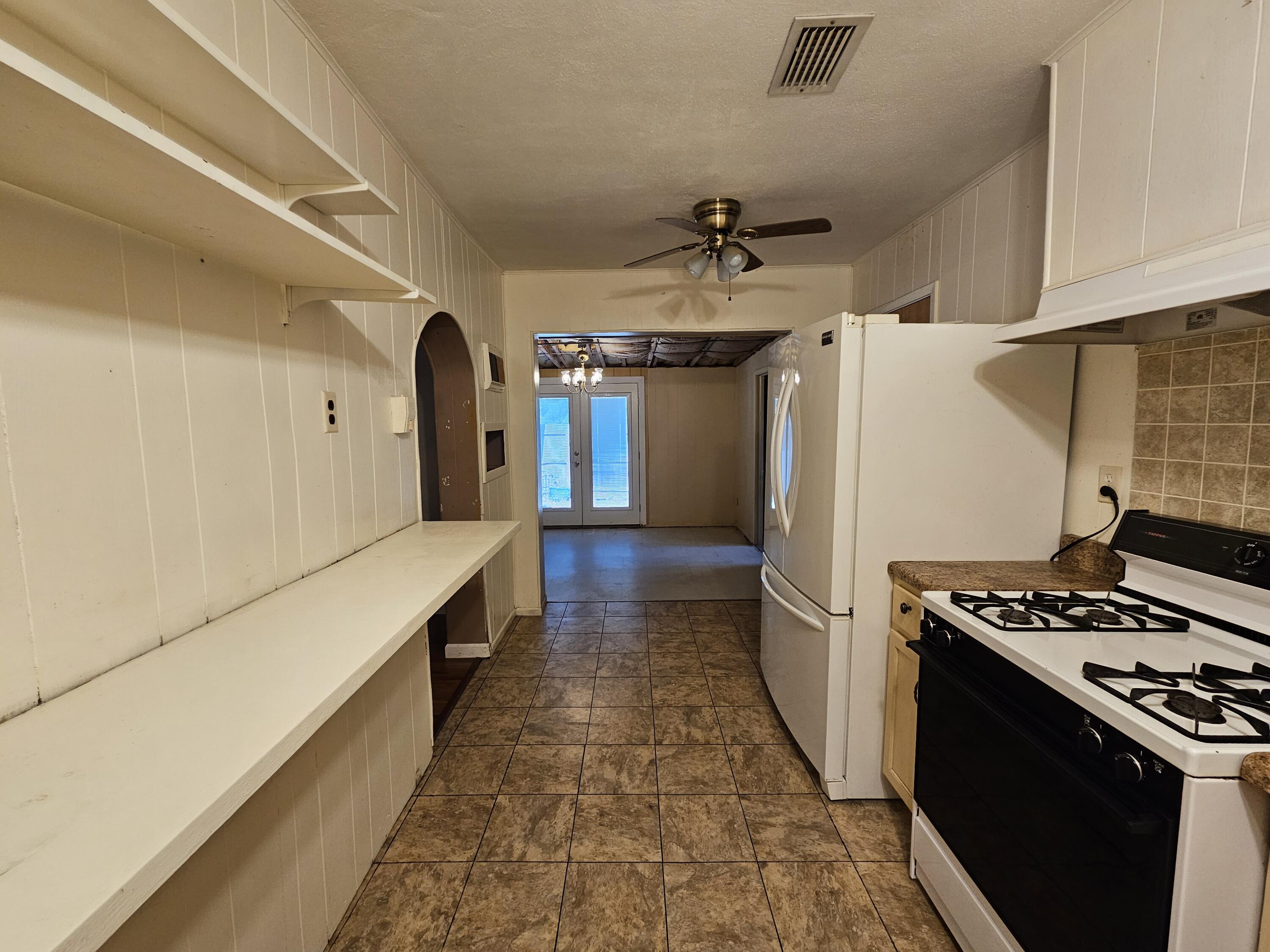 48 Ferry Road Northeast Fort Walton Beach, FL 32548 - Photo 9 of 62 Open shelves and dinning room is direcly