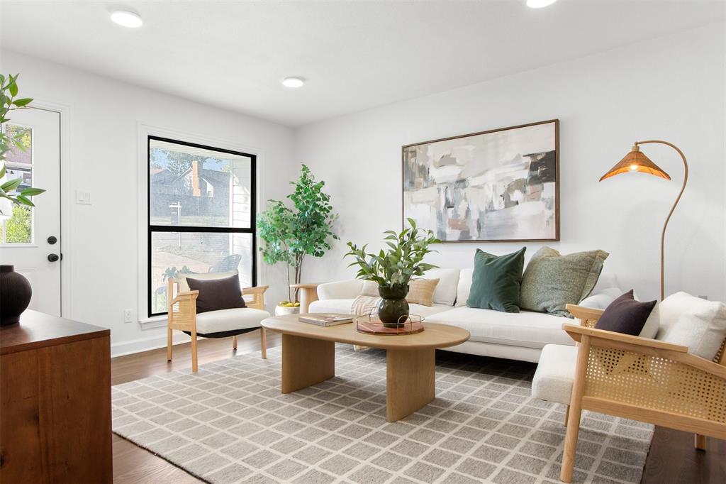 113 West State Street Garland, TX 75040 - Photo 4 of 31 a living room with furniture and a potted plant