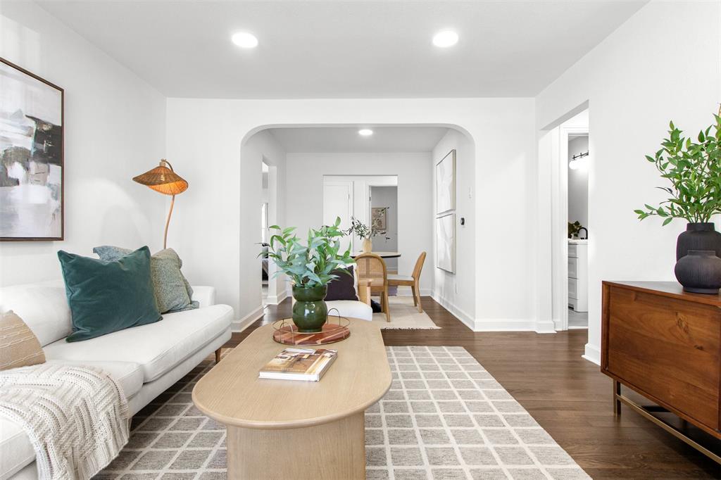 113 West State Street Garland, TX 75040 - Photo 7 of 31 a living room with furniture and wooden floor