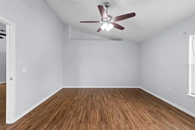 a view of a backyard with plants and a patio