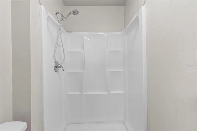 a view of a house with backyard and garden