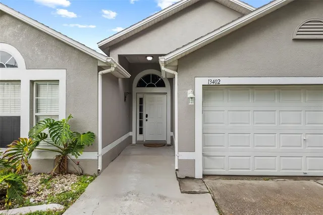 a view of walk in closet with wooden floor